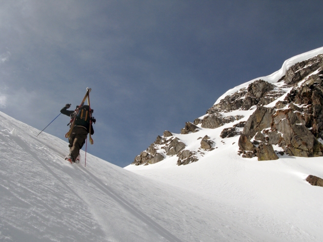 Ryan traversing the top of the exit couloir with the summit of Black Mountain looming above.